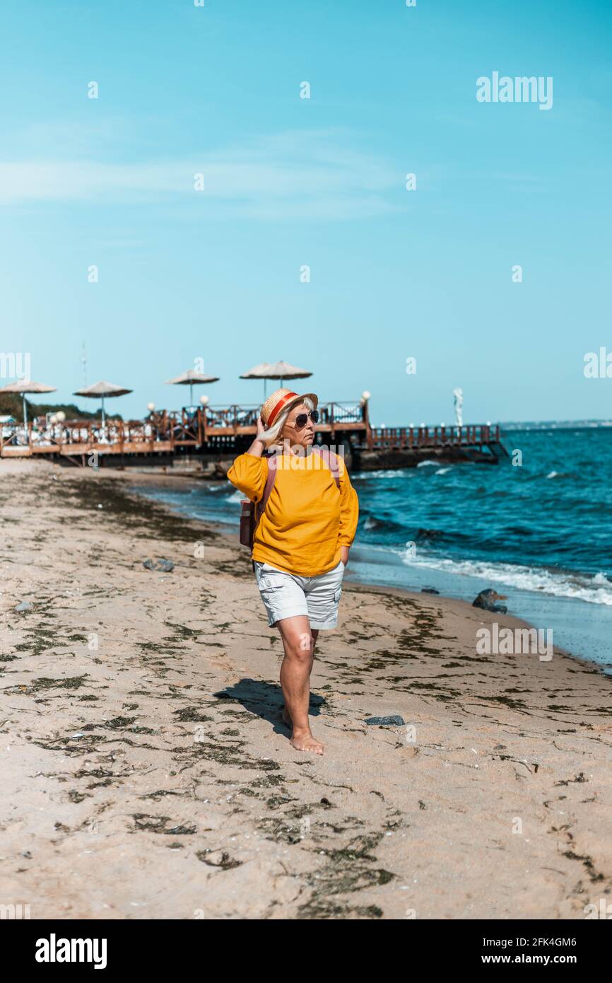 Happy smiling old woman walks hi-res stock photography and images - Alamy
