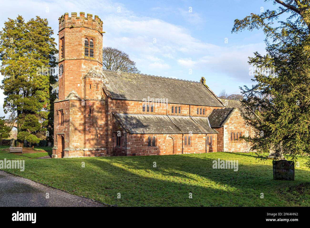 Holy Trinity Church built of red sandstone at Wetheral, Cumbria UK Stock Photo