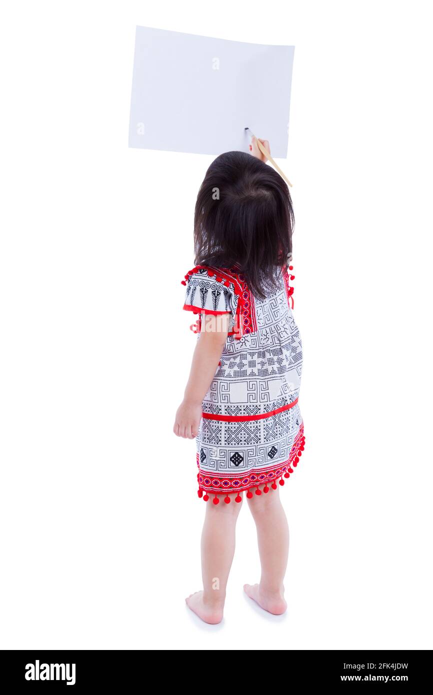 Full body. Back view of little girl painting on the blank copy space with paintbrush, isolated on white background. Studio shot Stock Photo