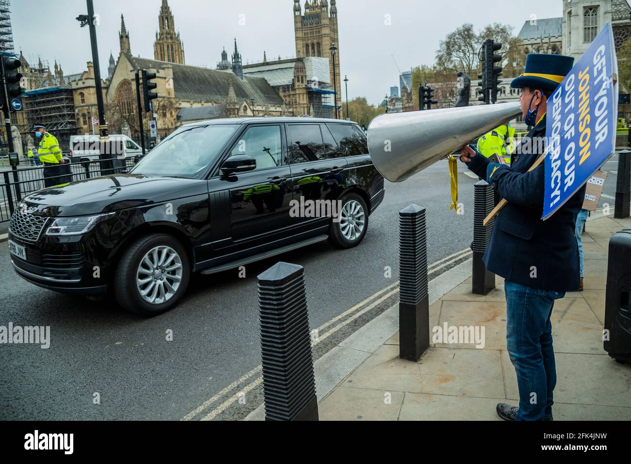London, UK. 28th Apr, 2021. Heckling a ministerial car as it passes - Steve Bray of Sodem, pro EU protester, has now switched his attention to Tory 'sleaze' - outside Parliament after Prime Ministers Questions. Credit: Guy Bell/Alamy Live News Stock Photo