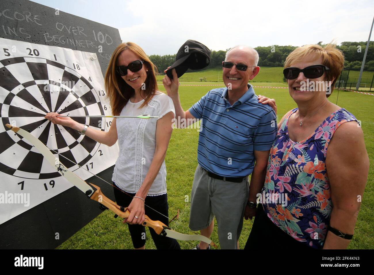 Ayr Archery Club held an open day 'Come and try Archery ' at the J.Mowatt playing fields Doonside, Ayr Lorna Jones almost scores a bull and his congratulated by her dad Jim & Mum Moira from Dundonald Stock Photo