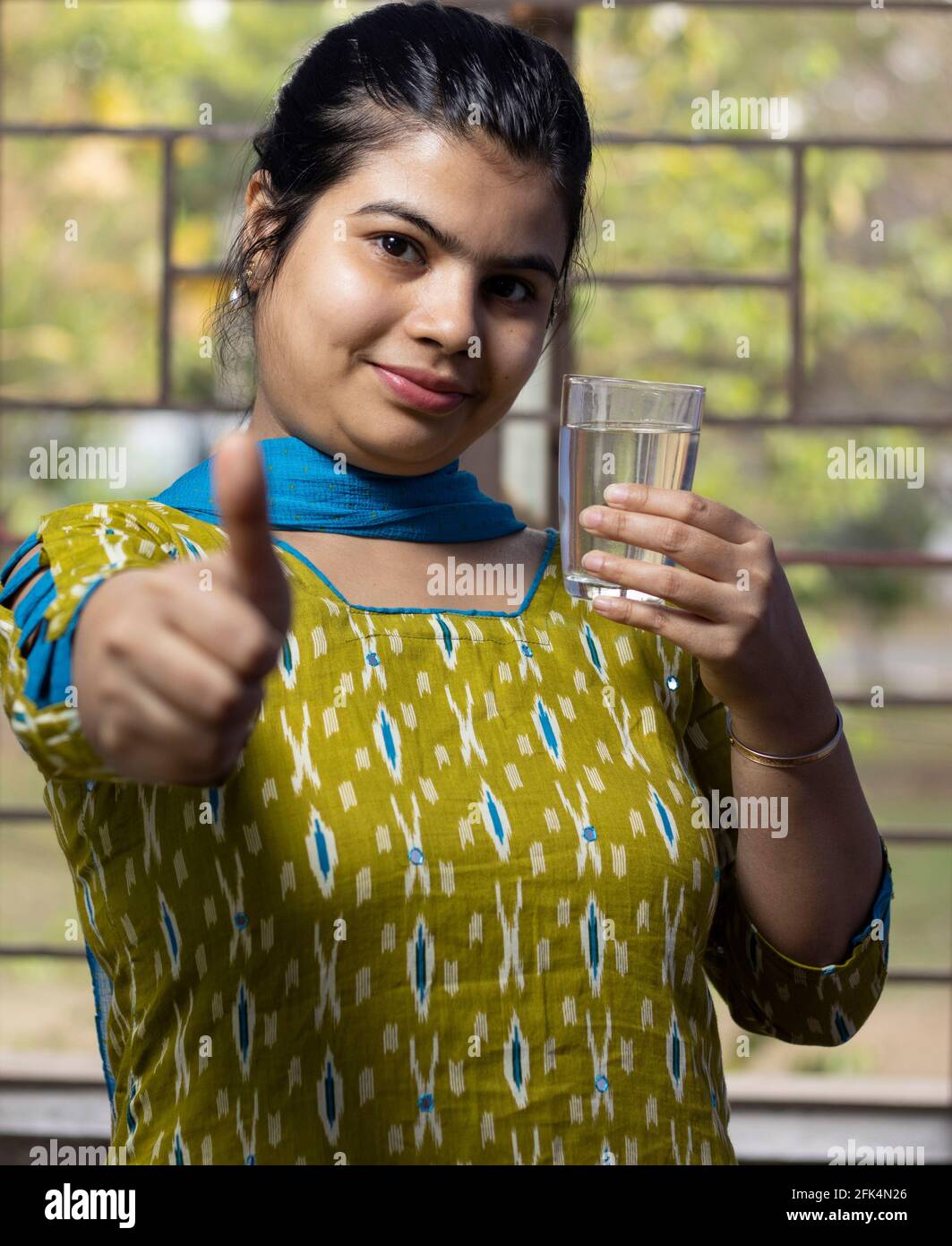 Indian woman showing thumbs up hi-res stock photography and images - Alamy