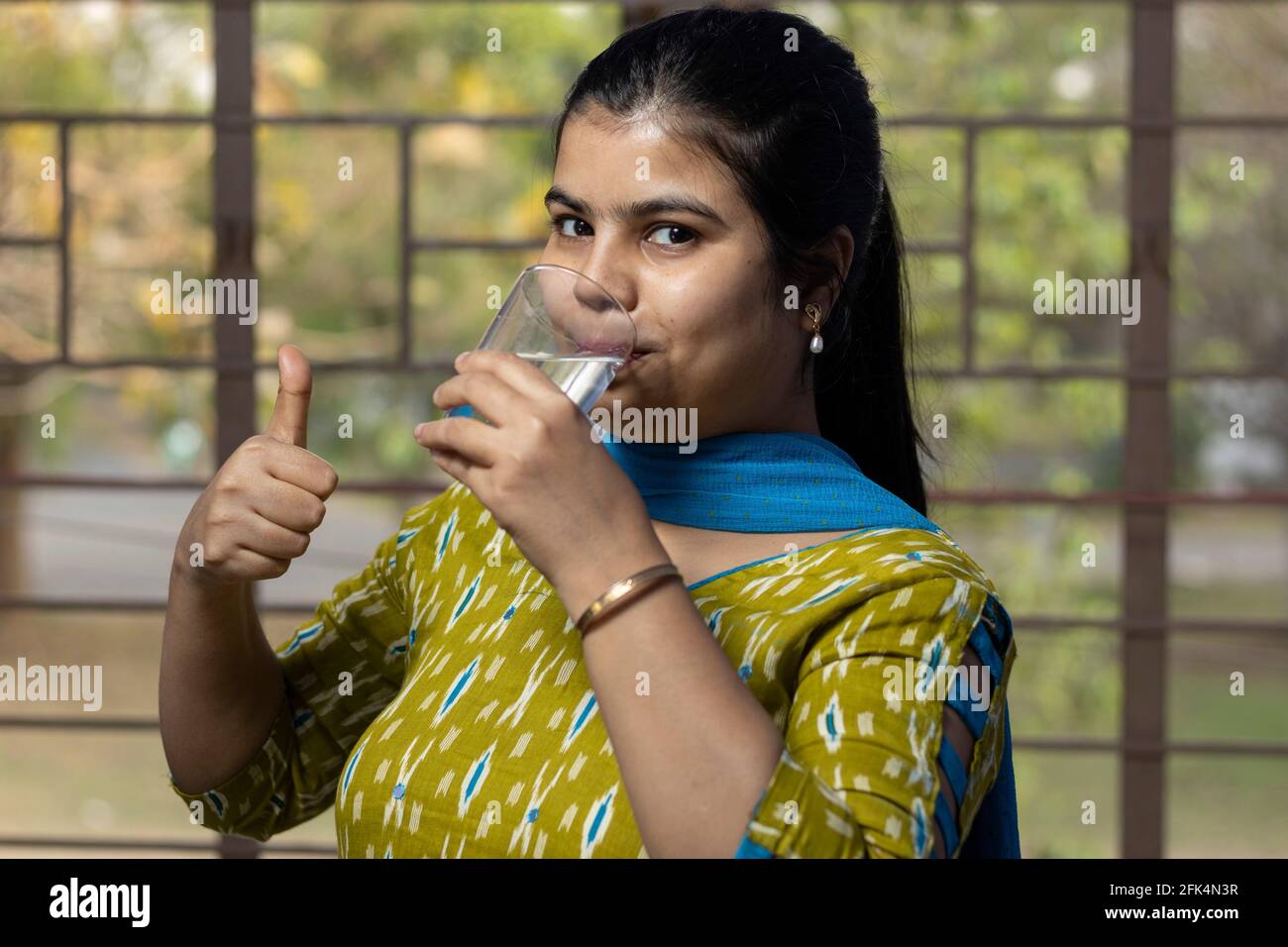 Indian adult woman thumbs up hi-res stock photography and images - Alamy