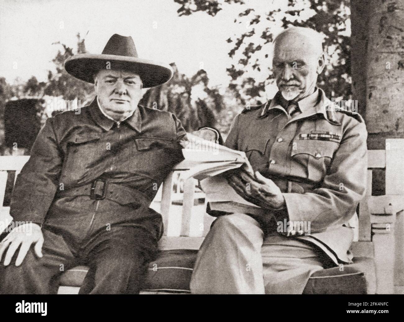 Winston Churchill, left, with General Smuts, Cairo, Egypt, 1942.  Sir Winston Leonard Spencer-Churchill, 1874 – 1965. British politician, army officer, writer and twice Prime Minister of the United Kingdom.  Field Marshal Jan Christian Smuts, 1870 – 1950.  South African statesman, military leader, and philosopher Stock Photo