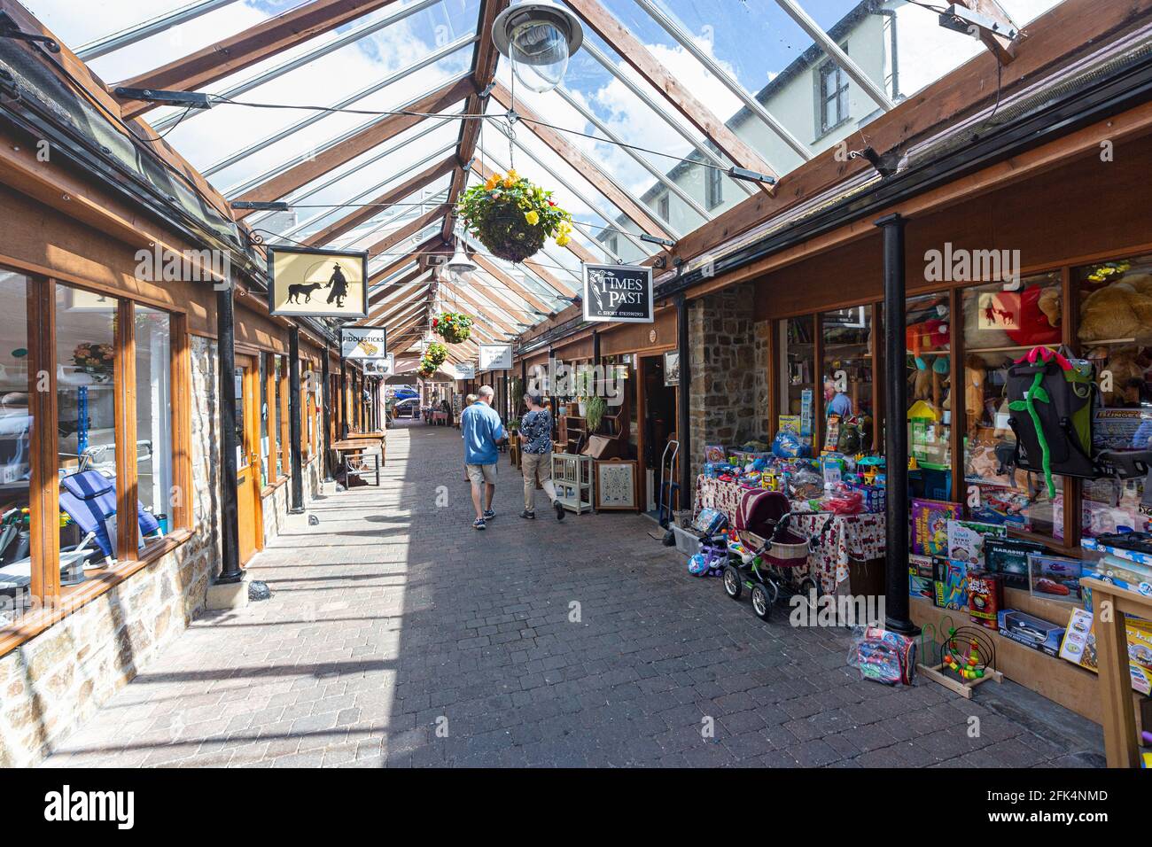 Interior of Great Torrington Pannier Market, Shops and Glass Roof Detail Looking Towards the Main Town Entrance and Torrington Square #2 Stock Photo