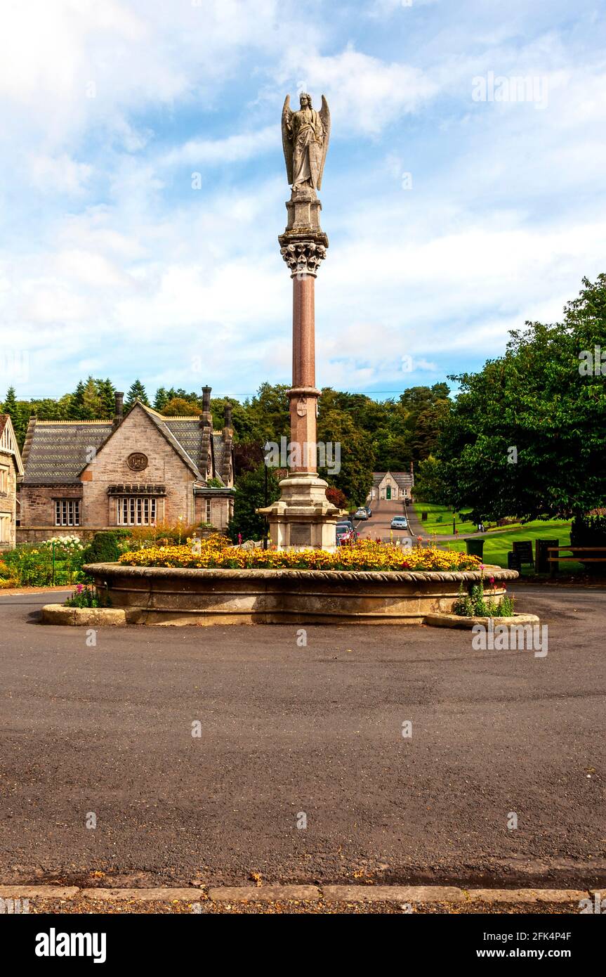 The former fountain now a planter, is a memorial commissioned by Lady Waterford for her husband c. 1860, it has a tall polished pink granite column Stock Photo