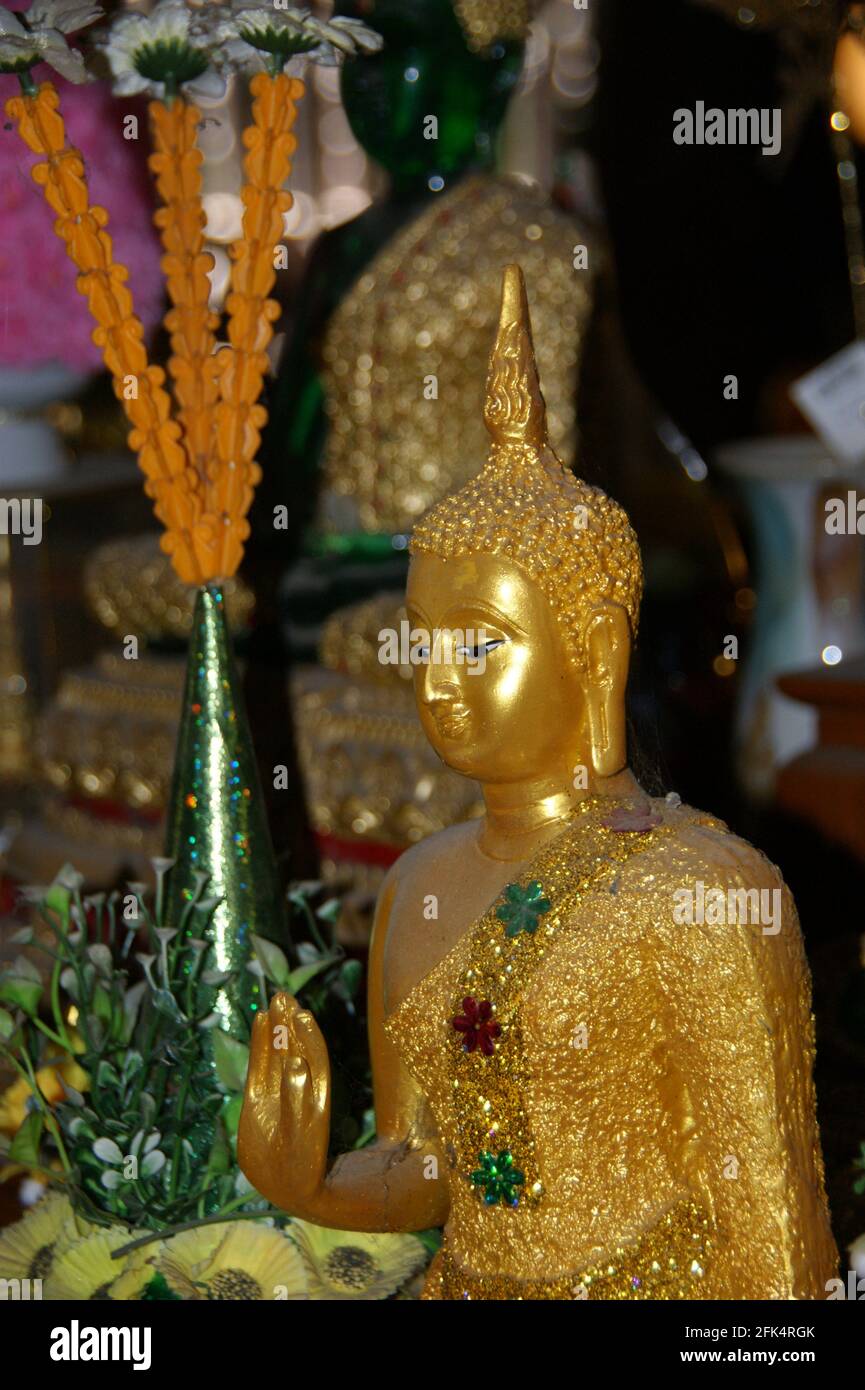 Golden Buddha in the abhaya mutra pose for peace and fearlessness. Stock Photo