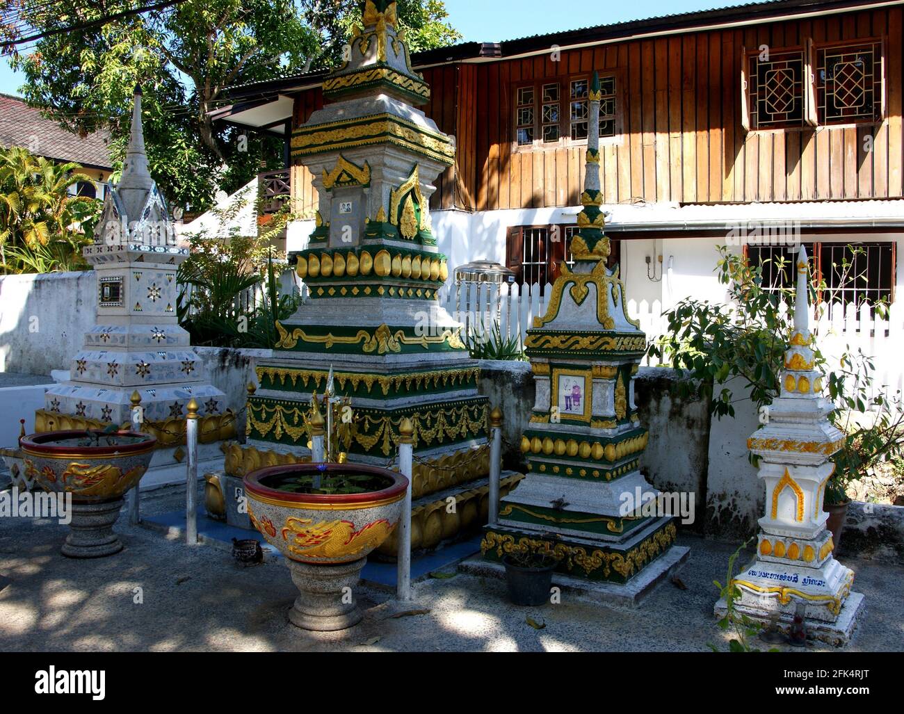 Elaborate burial stupas in Laos with photos of the deceased whose remains are contained within. Stock Photo