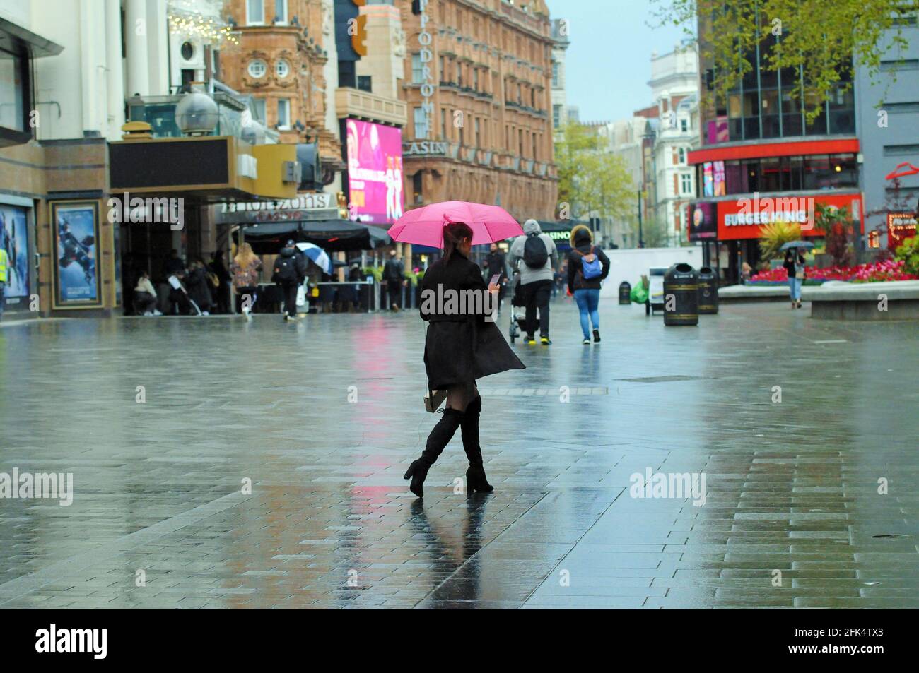London, UK. 28th Apr, 2021. Rainy day in London West End. Credit: JOHNNY ARMSTEAD/Alamy Live News Stock Photo