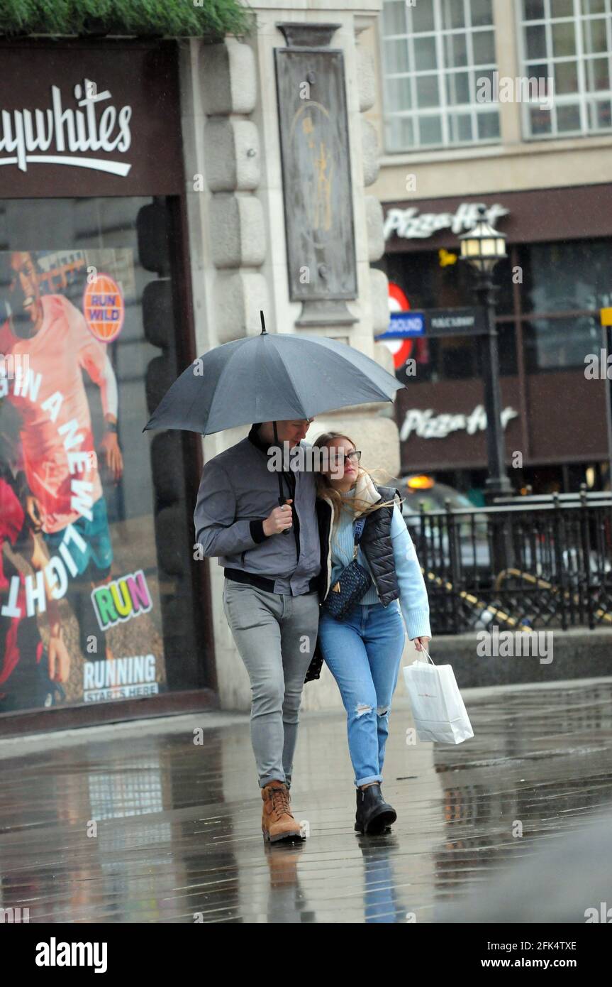 London, UK. 28th Apr, 2021. Rainy day in London West End. Credit: JOHNNY ARMSTEAD/Alamy Live News Stock Photo