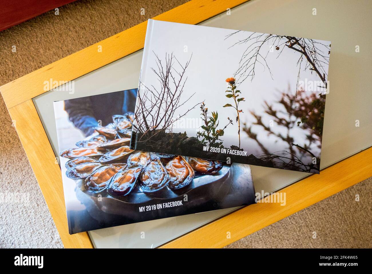 Two Facebook Pastbooks, This is a promotion by Facebook , where the photos you posted in a given year get printed as a yearbook Stock Photo