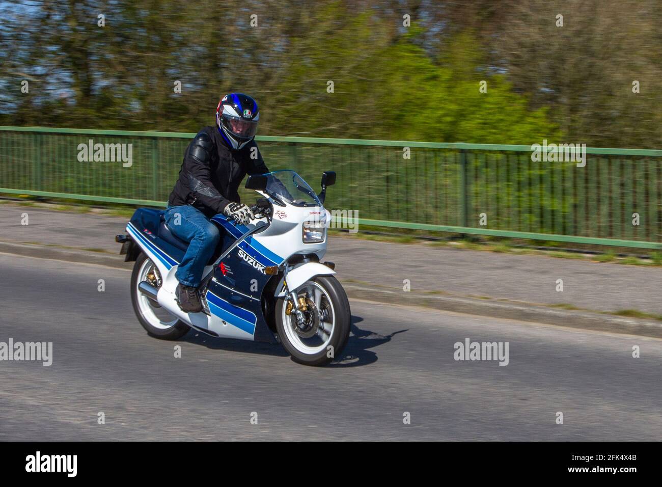 1987 80s blue white Suzuki 250cc sports, AEC RGR; Motorbike rider; two wheeled transport, motorcycles, vehicle, roads, motorbikes, motorcycle bike riders motoring in Chorley, UK Stock Photo