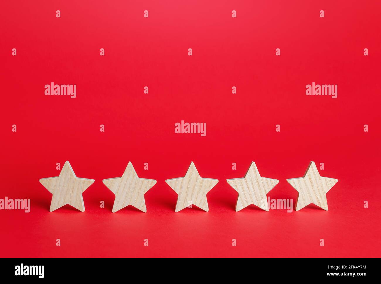 Five stars on a red background. Rating evaluation concept. Service quality feedback. High satisfaction. Good reputation. Popularity rating of restaura Stock Photo