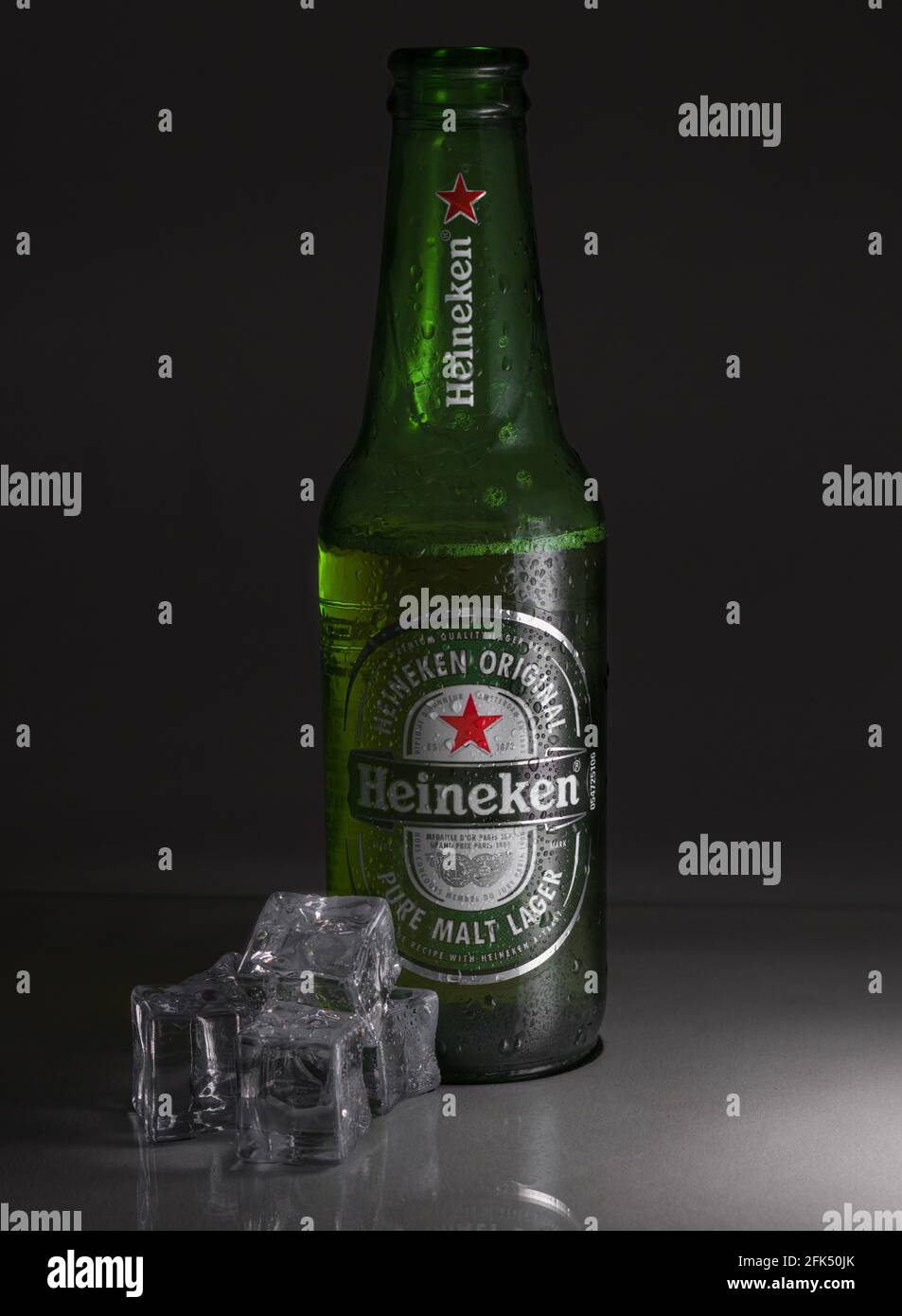 CORNELLA DE LLOBREGAT, SPAIN - Apr 21, 2021: bottle of heineken lager beer with ice with a dark background. Stock Photo