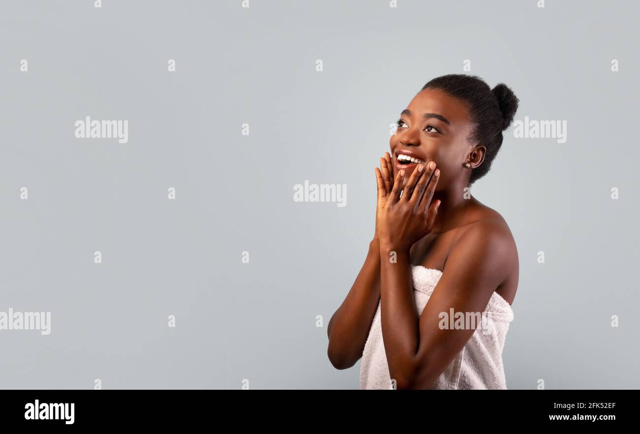 Flawless beauty. Pretty african american lady touching her soft smooth ...