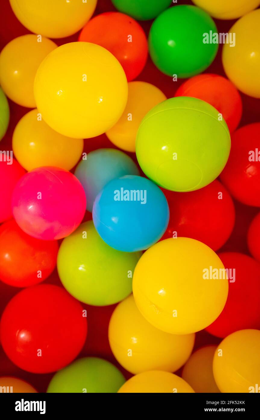 Multiple plastic coloured balls as background Stock Photo - Alamy