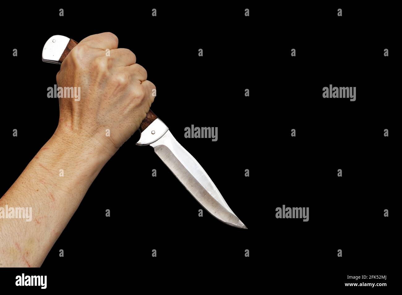https://c8.alamy.com/comp/2FK52MJ/human-hand-holding-knife-isolated-on-black-copyspace-2FK52MJ.jpg