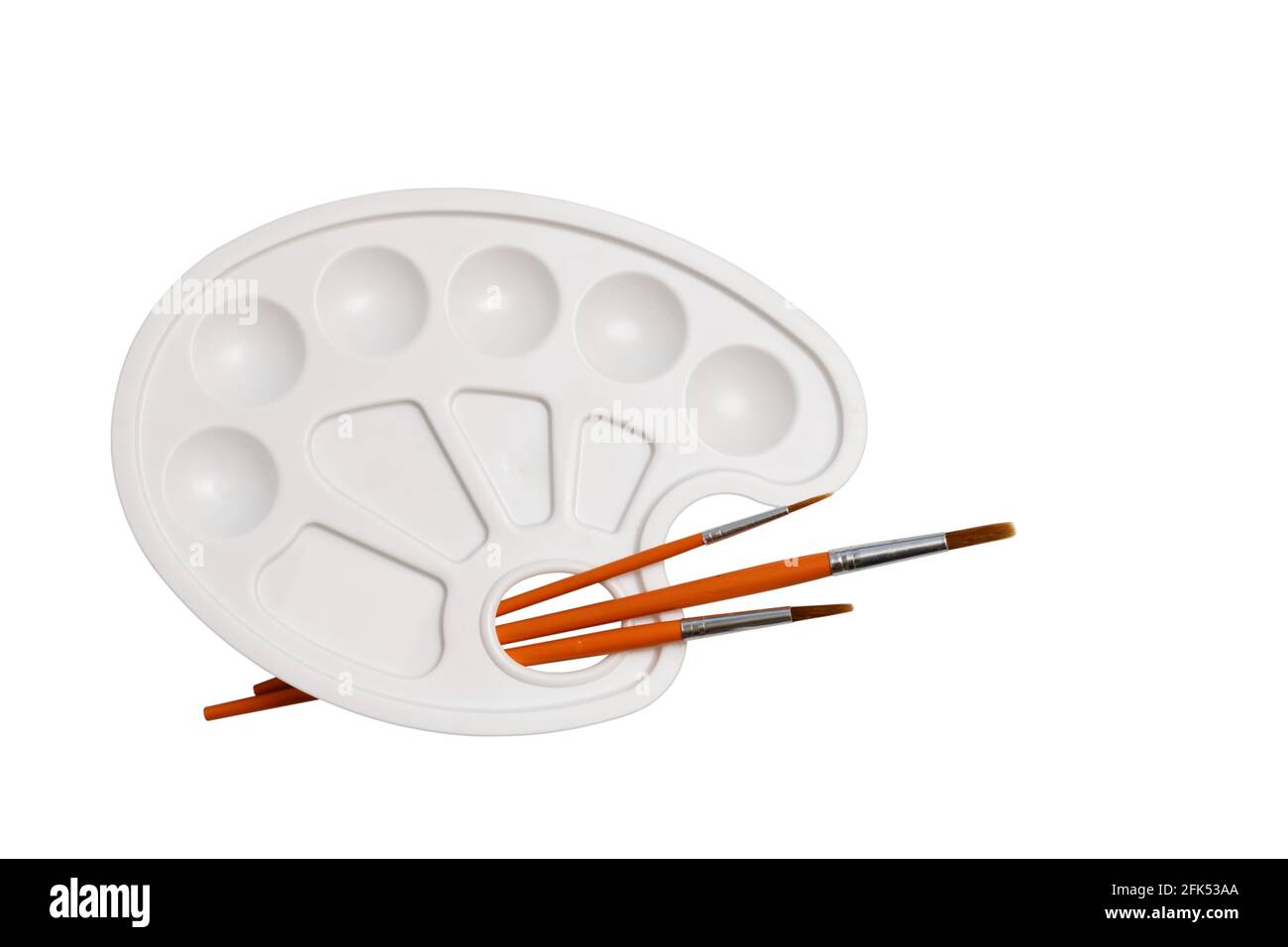 Brushes and palette isolated on a white Stock Photo