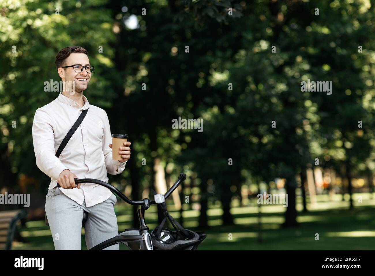Excellent mood at summer, employee with coffee to go, enjoying good morning outdoor Stock Photo