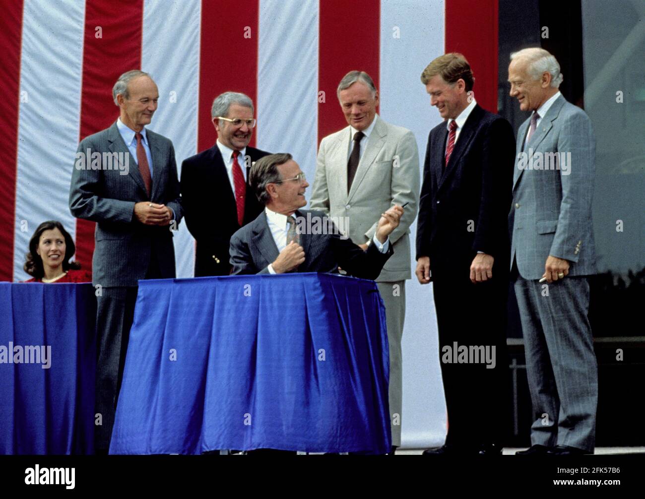 File photo - United States President George H.W. Bush signs a proclamation after announcing plans for the Space Exploration Initiative (SEI) on the the 20th anniversary of the Apollo 11 Moon landing at the National Air and Space Museum in Washington, D.C. on July 20, 1989. From left to right: Marilyn Quayle (seated); Apollo 11 Command Module pilot Michael Collins; NASA Administrator Richard H. Truly; President Bush; Apollo 11 Command pilot Neil A. Armstrong; U.S. Vice President Dan Quayle; and Apollo 11 Lunar Module pilot Edwin (Buzz) Aldrin. --- American astronaut Michael Collins, who flew th Stock Photo
