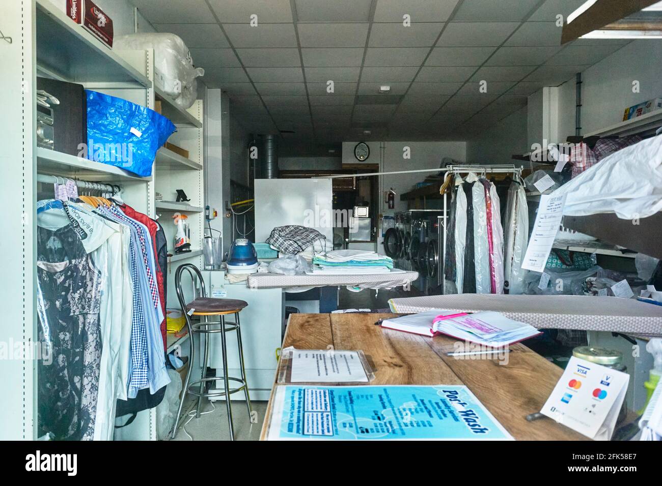 Looking into the window of a launderette and dry cleaners in Port Erin
