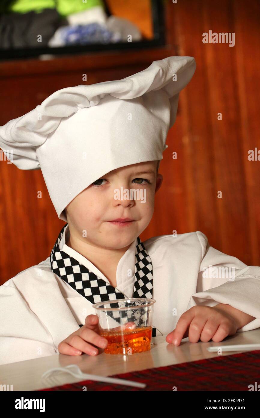 Tarbolton Primary School, Ayrshire, Scotland, UK. 26 Jan 2016 Burns Supper for nursery and Primary children. Little boy dressed as a chef Stock Photo