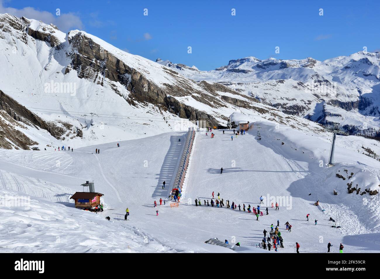 The rolling carpet tunnel at the ski resort of Anzere in Southern  Switzerland Stock Photo - Alamy