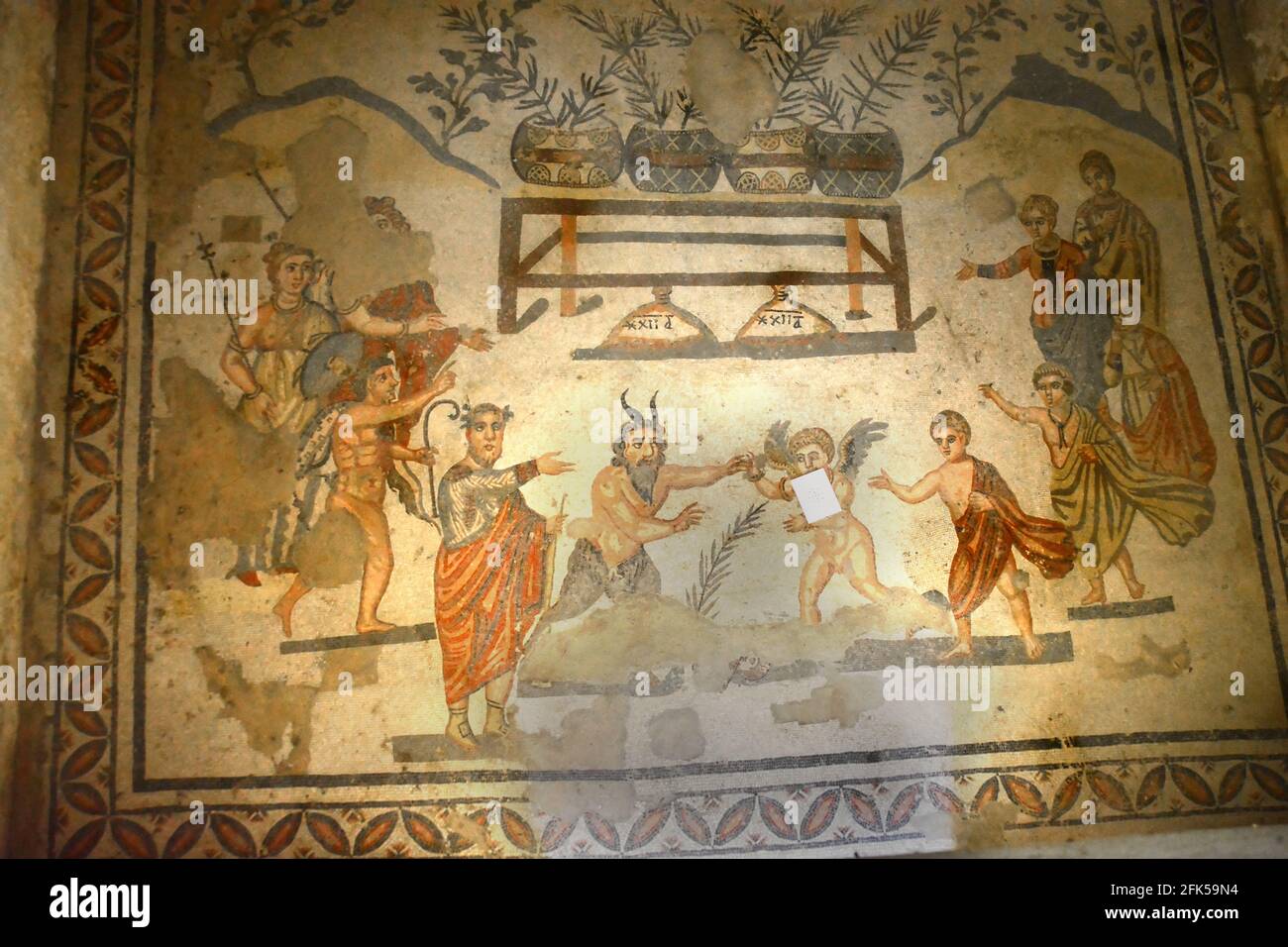 Ancient Roman mosaic of the God Pan in a struggle with Eros an alegory