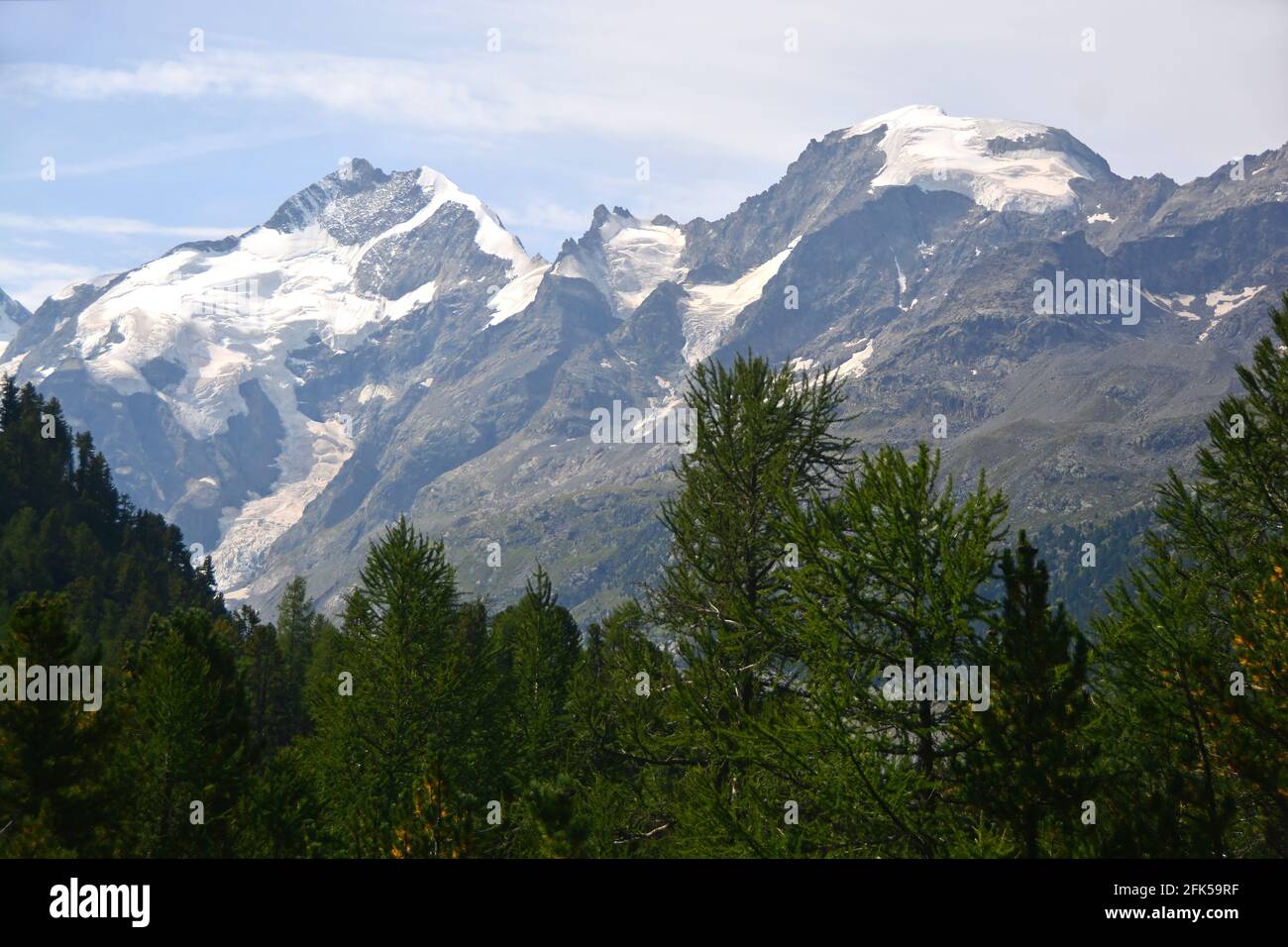 The Piz Bernina (centre) and Piz Morteratsch (right) viewed from the  Bernina Pass in southern Switzerland above St Moritz Stock Photo - Alamy