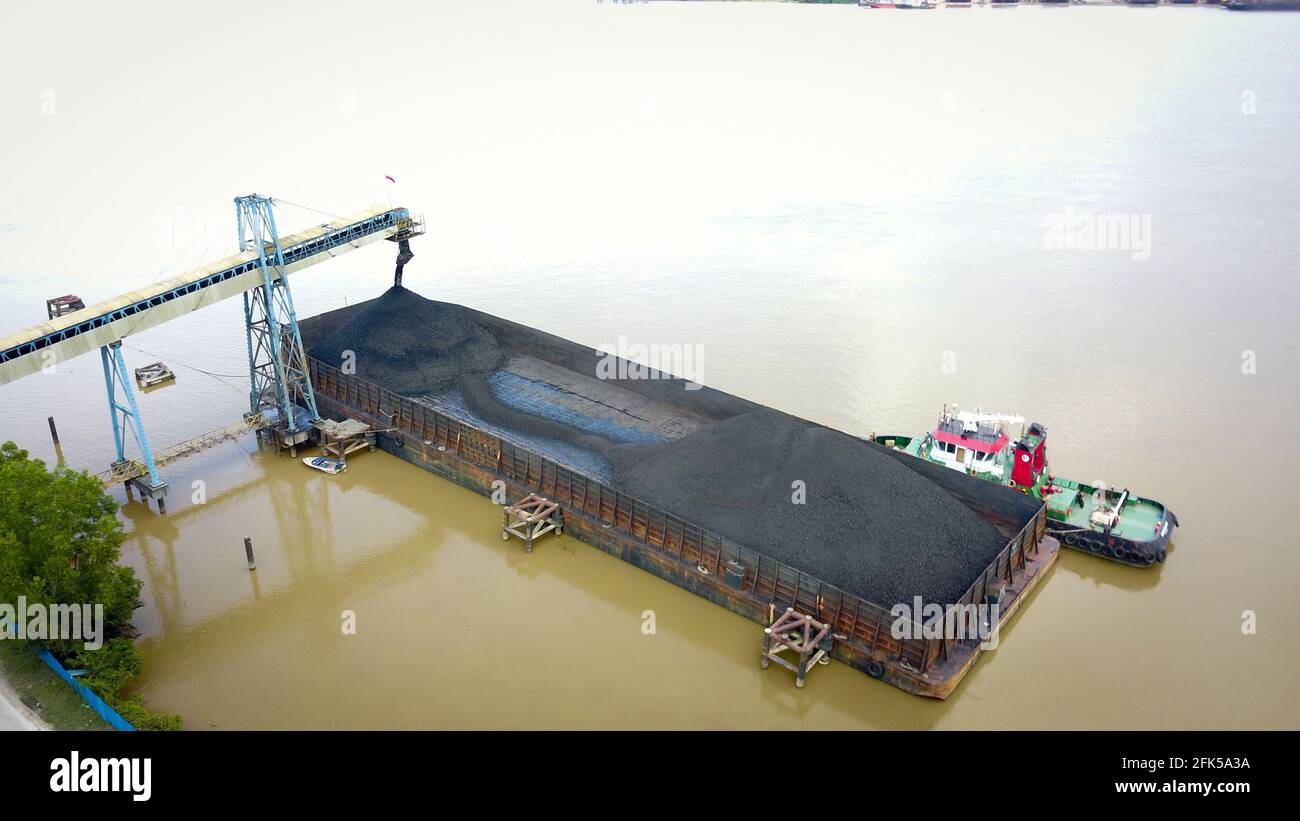 Coal Shipping in indonesia, loading the coal onto the barge aerial view
