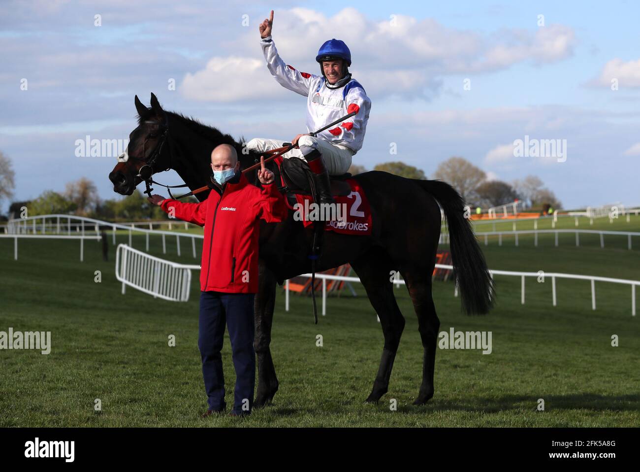 Sam Twiston-Davies celebrates winning The Ladbrokes Punchestown Gold Cup on Clan Des Obeaux during day two of the Punchestown Festival at Punchestown Racecourse in County Kildare, Ireland. Issue date: Wednesday April 28, 2021. Stock Photo