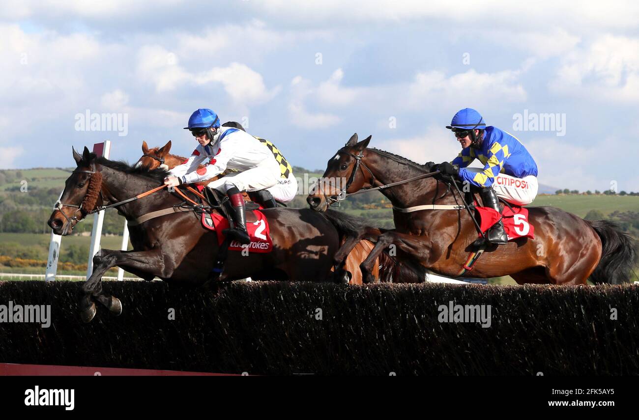 Clan Des Obeaux ridden by Sam Twiston-Davies (left) goes on to win The Ladbrokes Punchestown Gold Cup during day two of the Punchestown Festival at Punchestown Racecourse in County Kildare, Ireland. Issue date: Wednesday April 28, 2021. Stock Photo