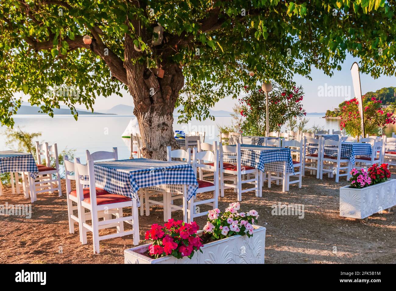 Lefkada, Greece. Seaside taverna on a sunny morning. Stock Photo