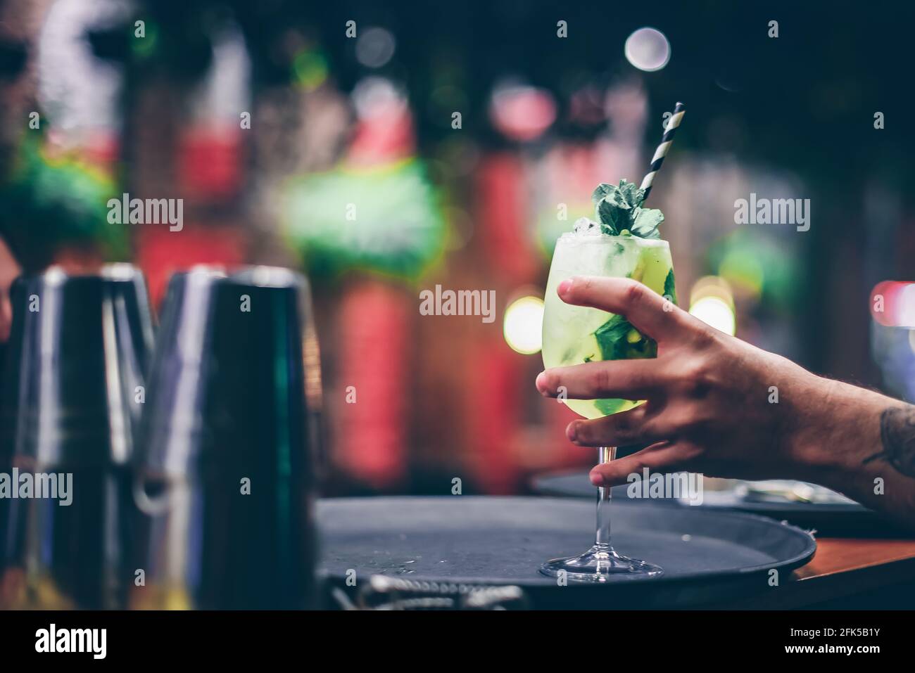 Refreshing lemonade drink with lemon and water, with ice. Stock Photo