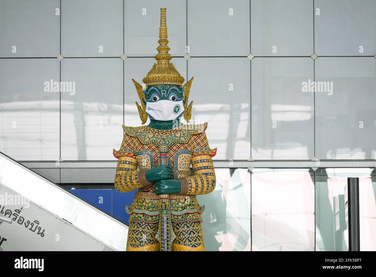 A giant statue wearing a face mask at Suvarnabhumi airport. Ministry of