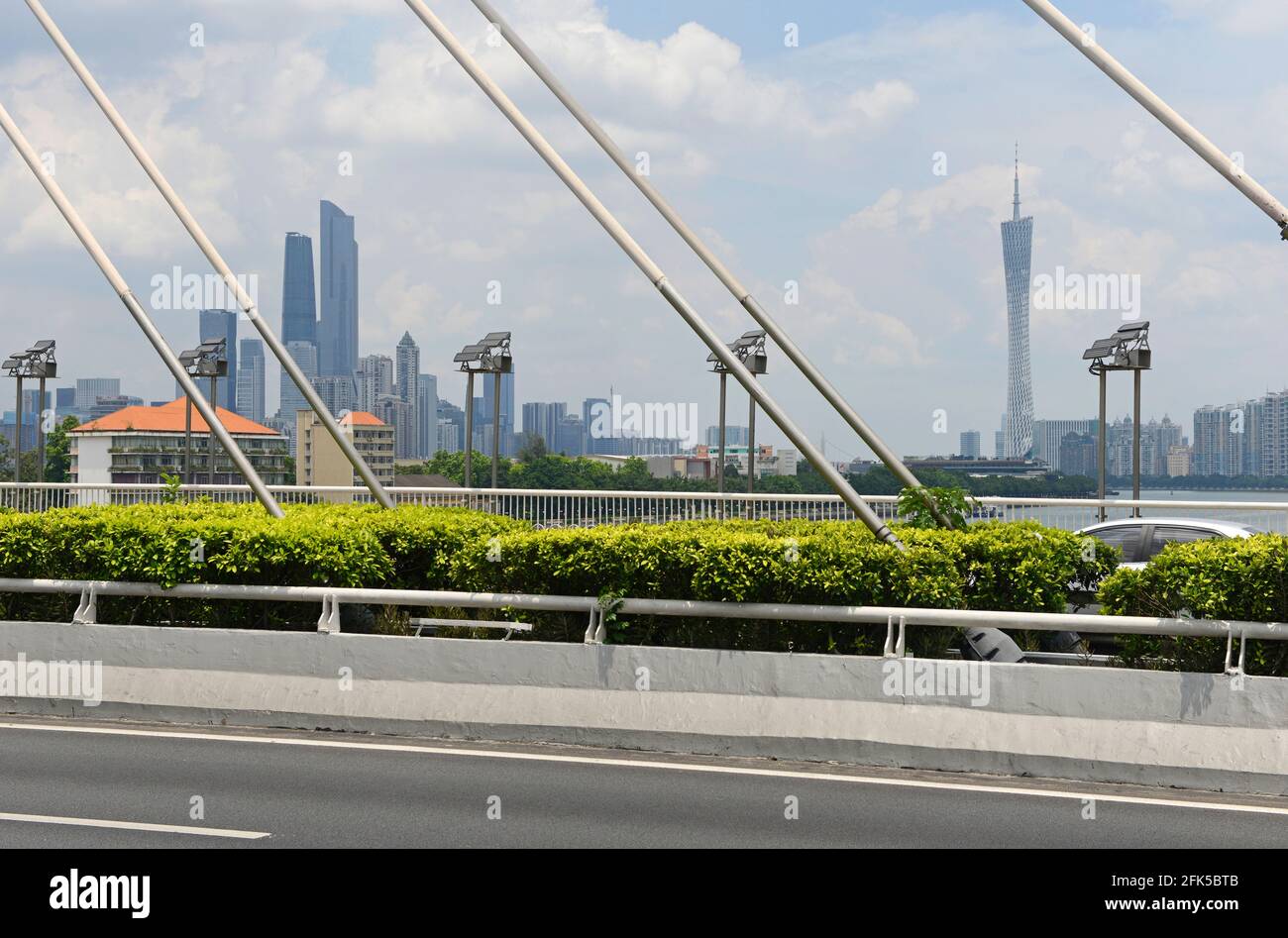 View of Haiyin bridge over the Pearl river in Guangzhou, China, looking eastwards down river to the Canton tower and tall buildings of Tianhe district Stock Photo