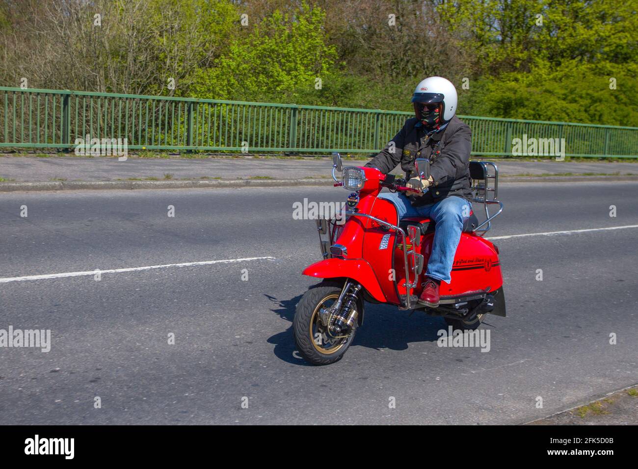 2015 red Scomadi Turismo Leggera 125; Motorbike rider; two wheeled  transport, motorcycles, vehicle, roads, scooters, motorcycle bike riders  motoring in Chorley, UK Stock Photo - Alamy