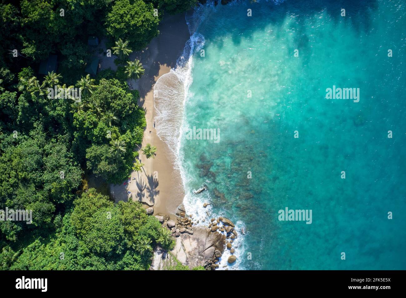 Drone field of view of secret cove and coastline Mahe, Seychelles. Stock Photo
