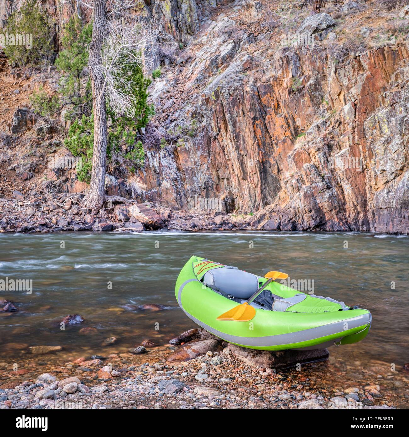 inflatable whitewater kayak with a paddle Poudre River above Fort