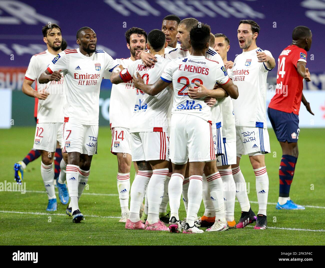 Players of Lyon celebrate their second goal during the French