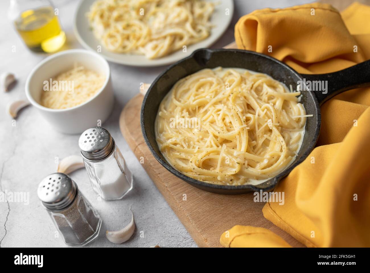 Alfredo pasta dinner with creamy white sauce with herbs seasoning