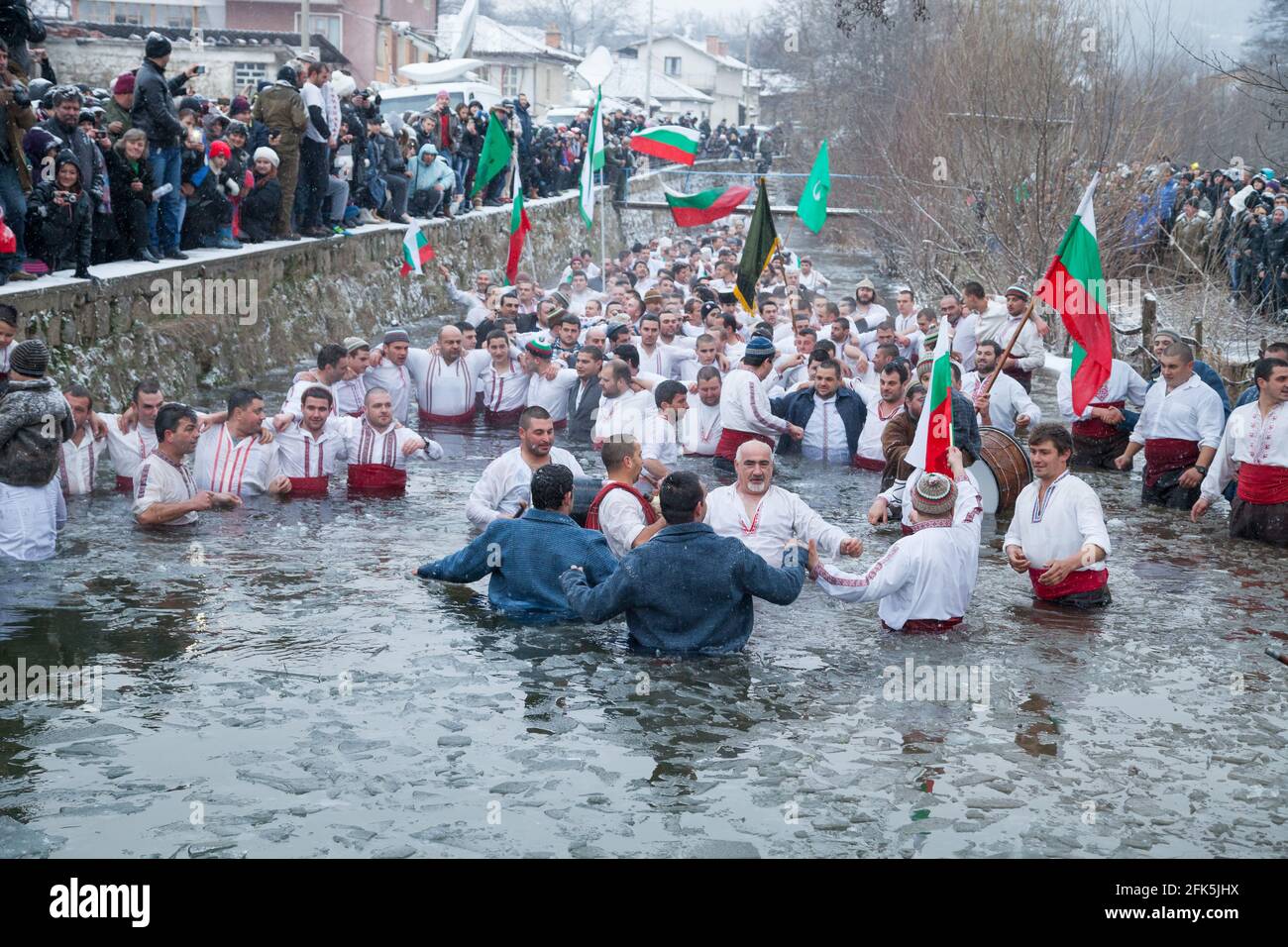 Epiphany Traditions - Jordan Day. Entrained cross, and men play dance in the icy waters of the Tundzha River on January 6, 2015, Kalofer, Bulgaria Stock Photo