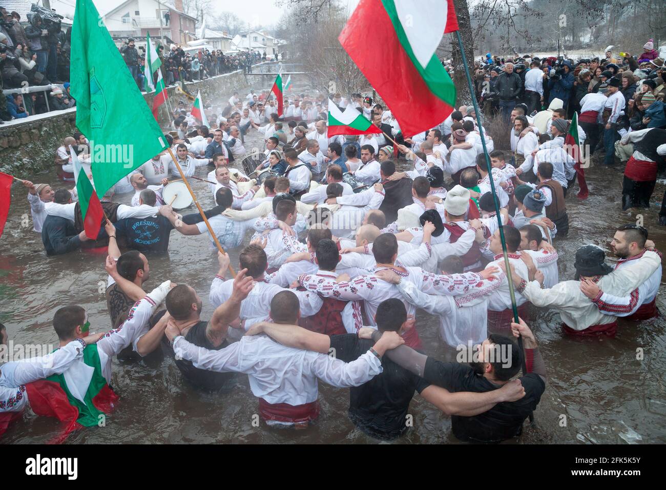 Epiphany Traditions - Jordan Day. Entrained cross, and men play dance in the icy waters of the Tundzha River on January 6, 2015, Kalofer, Bulgaria Stock Photo