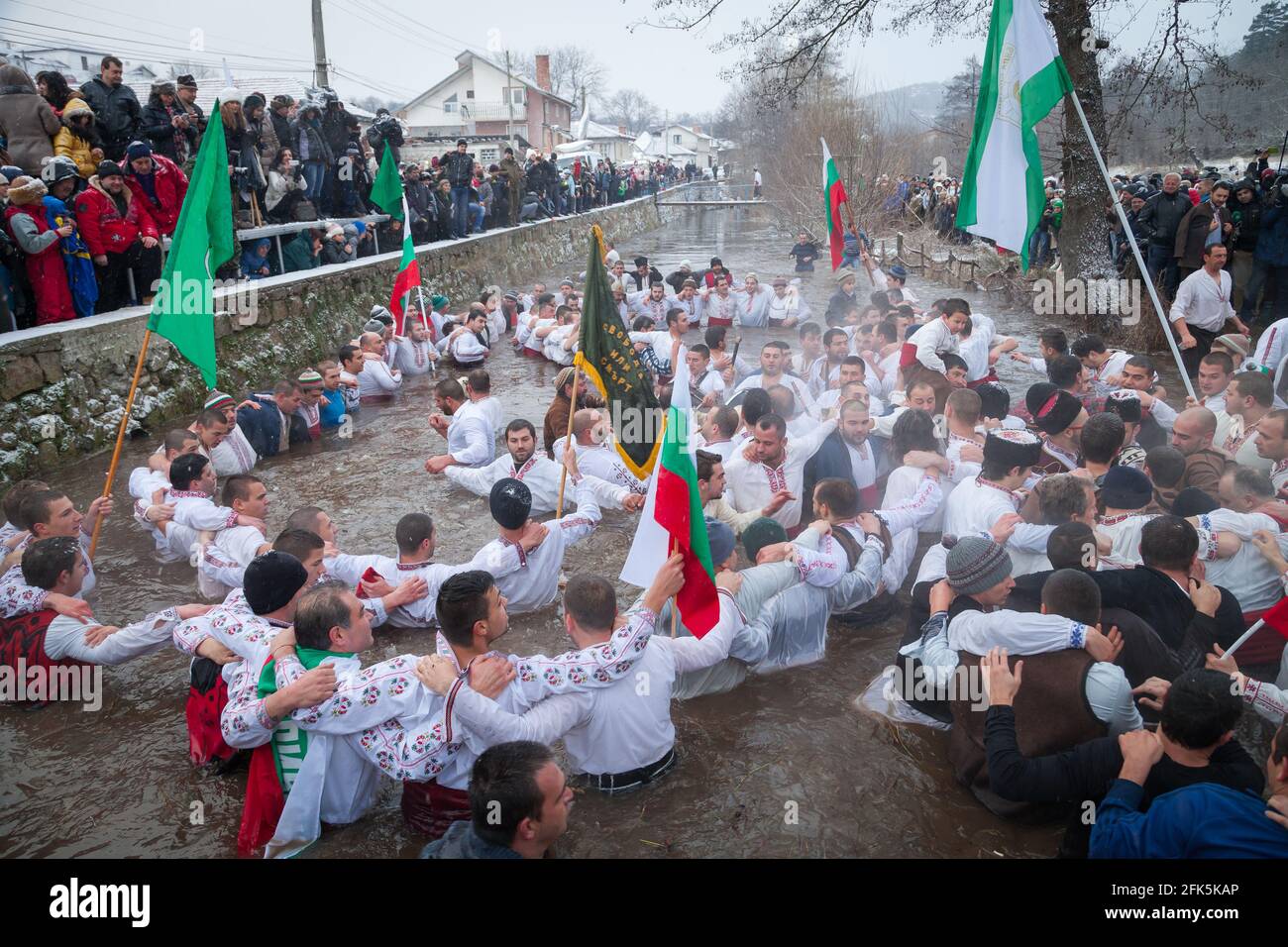Epiphany Traditions - Jordan Day. Entrained cross, and men play dance in the icy waters of the Tundzha River on January 6, 2015, Kalofer, Bulgaria Stock Photo