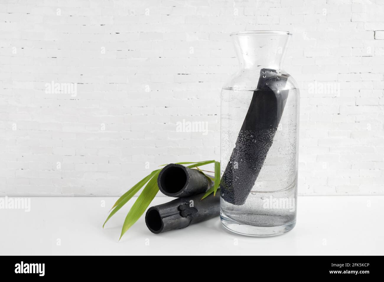 Natural Bamboo charcoal water filter. Deodorization, air filtration, and purifier water concept. Stock Photo