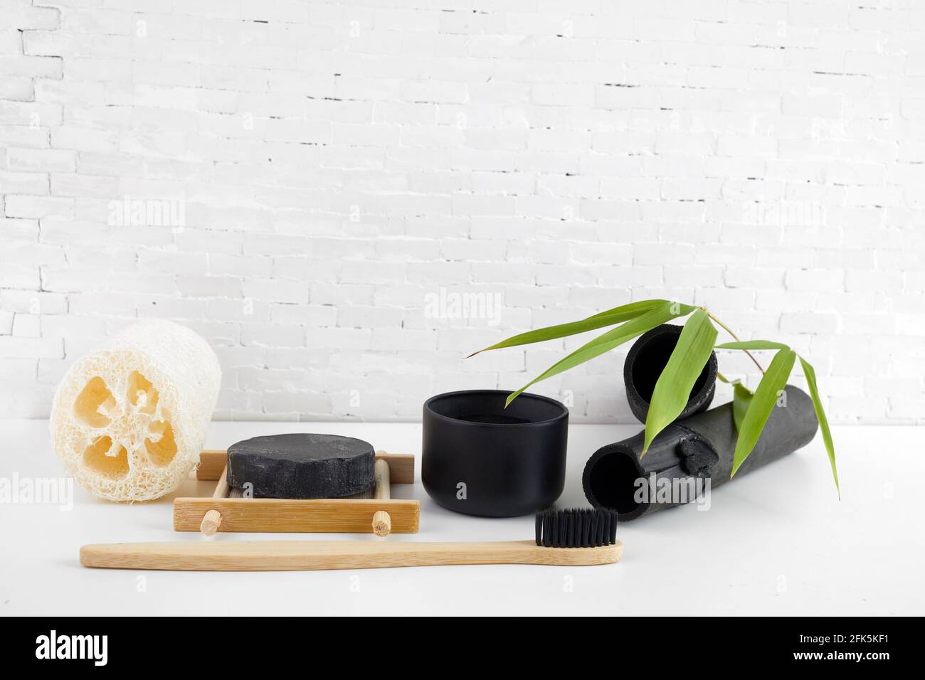 Natural bamboo charcoal cosmetic products. Deodorization, air filtration concept. Stock Photo