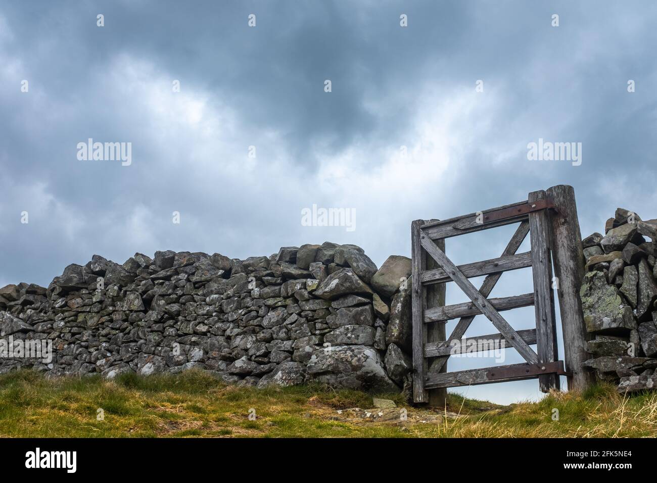 A Wooden Gate In An Old Dry Stone Wall In Scotland, With Copy Space Stock Photo