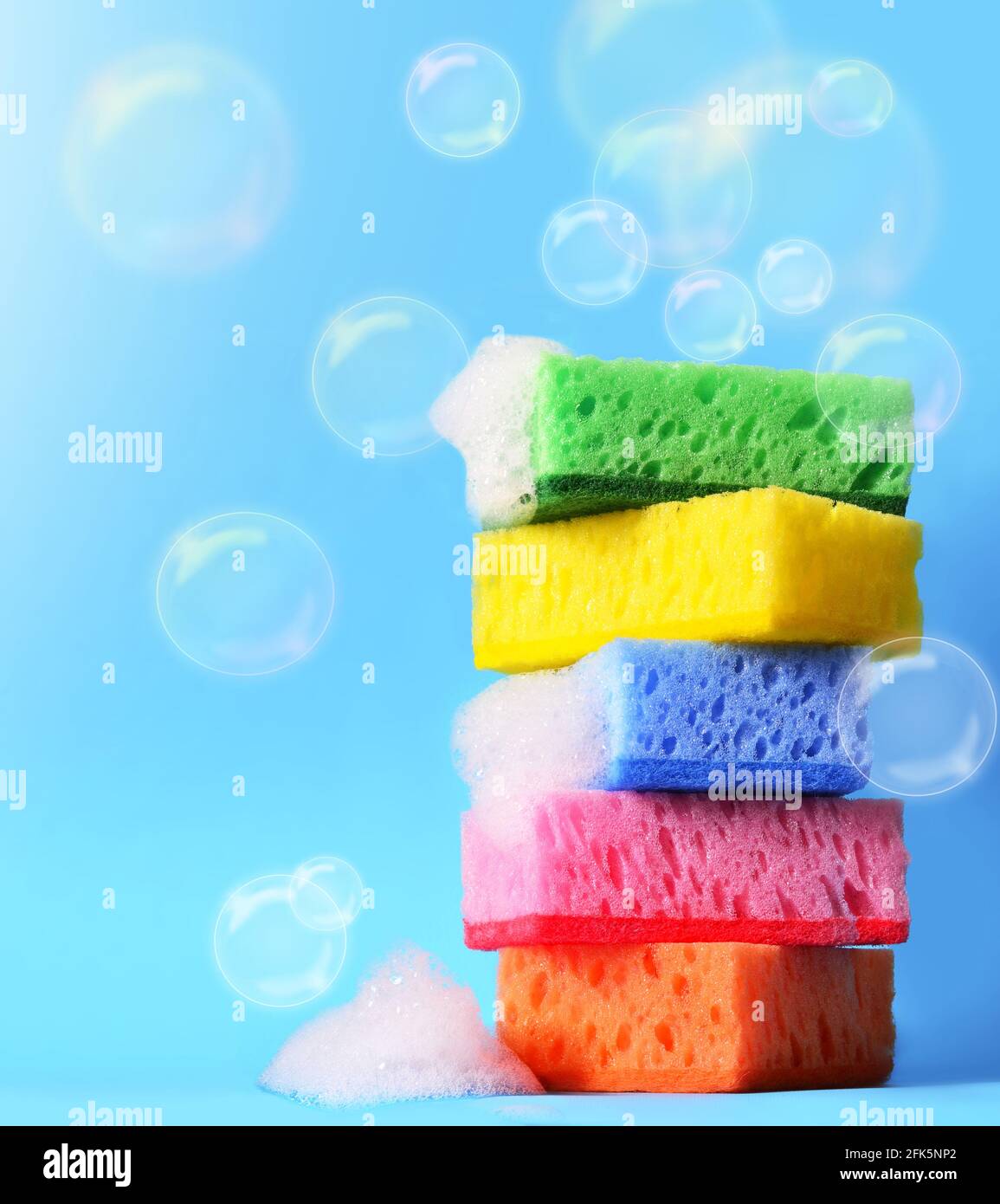 https://c8.alamy.com/comp/2FK5NP2/sponges-cleaning-kit-isolated-on-blue-background-and-foam-2FK5NP2.jpg