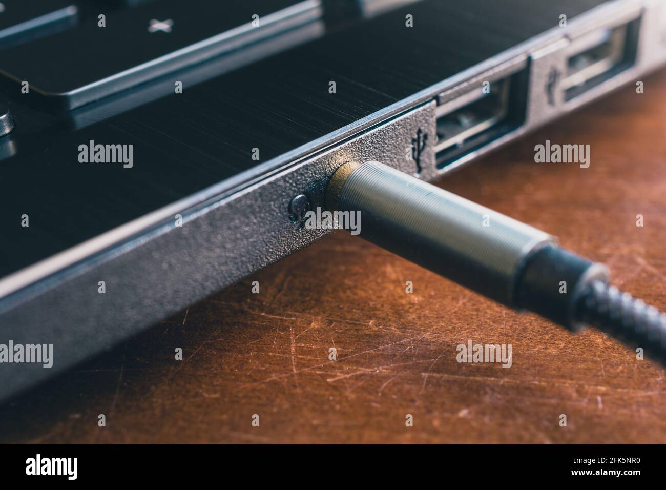 Headphone Cable Plugged In Headphone Jack Of A Notebook Stock Photo Alamy