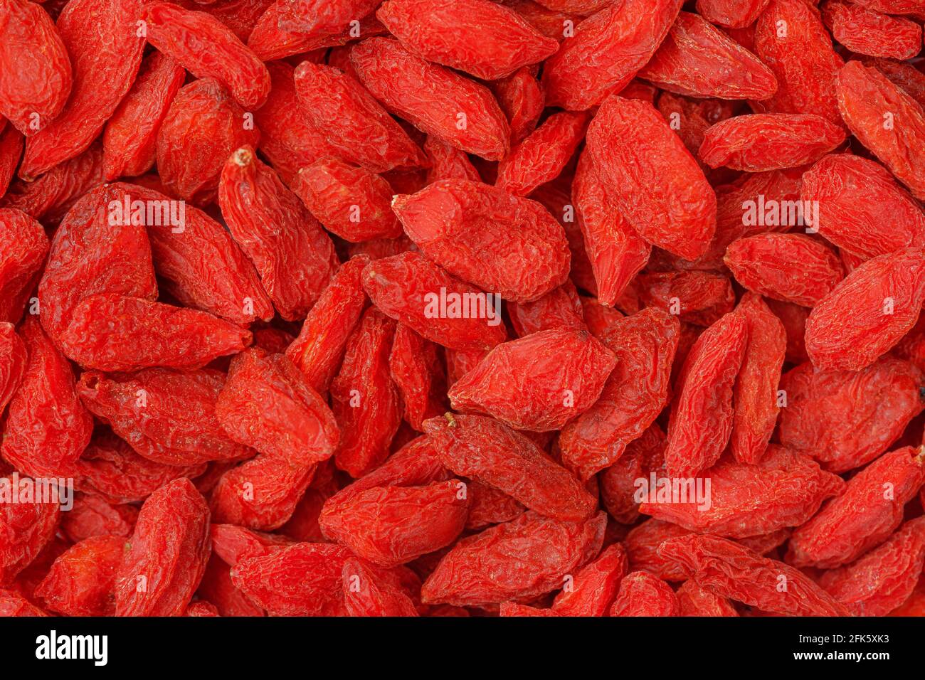 Goji berries background, organic superfoods concept. Stock Photo